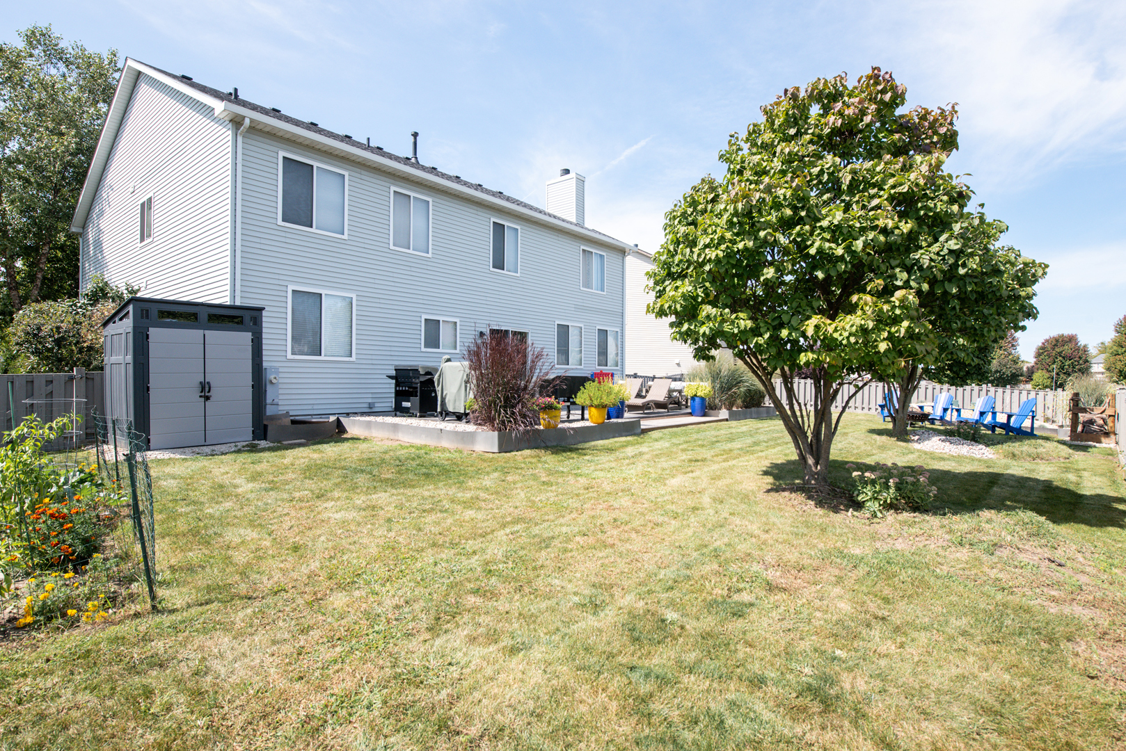 416 Hubbard Circle Plano, IL 60545 - Photo 37 of 57 a swimming pool with yard and trees in front of it