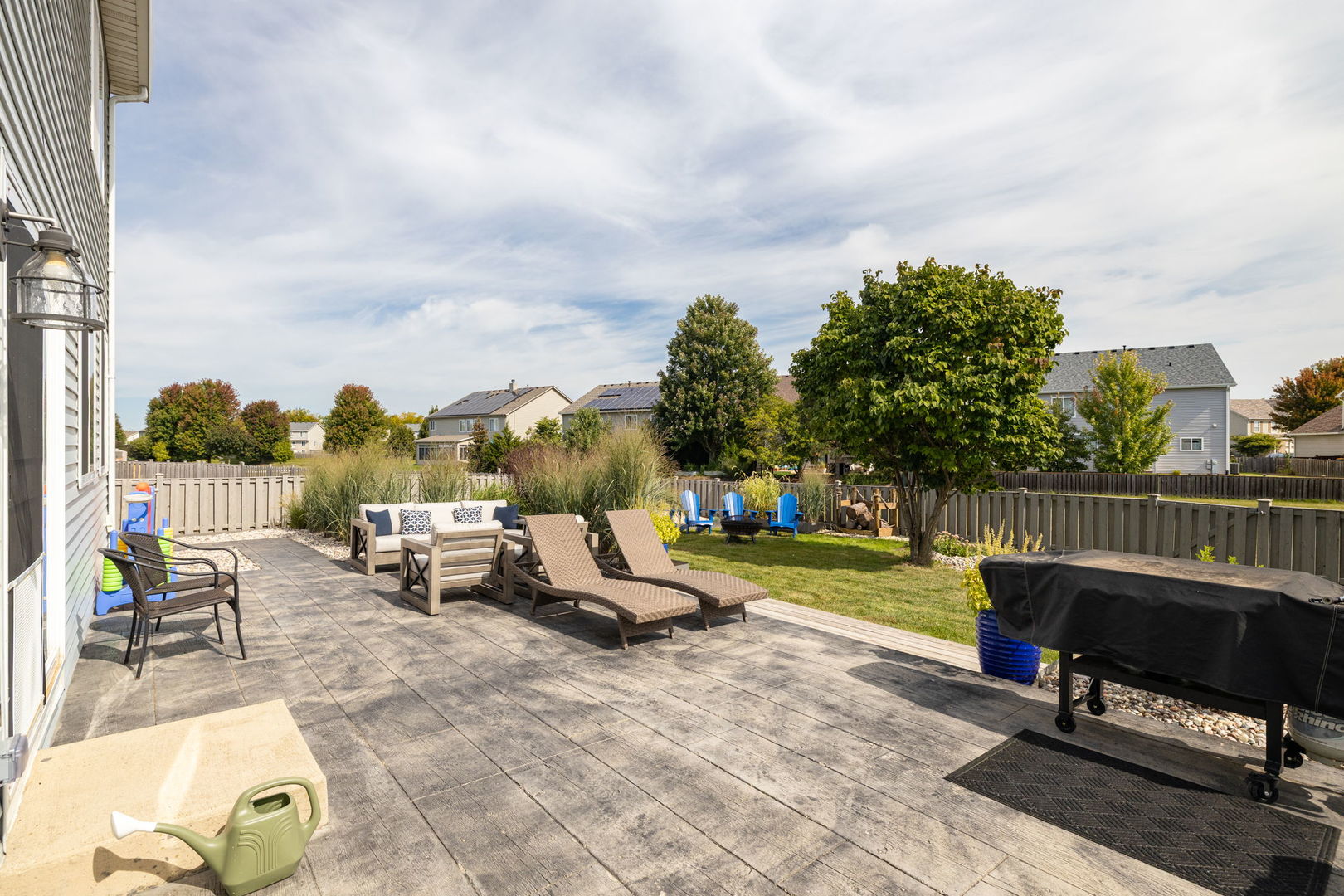 416 Hubbard Circle Plano, IL 60545 - Photo 40 of 57 an outdoor sitting area with couch and chairs