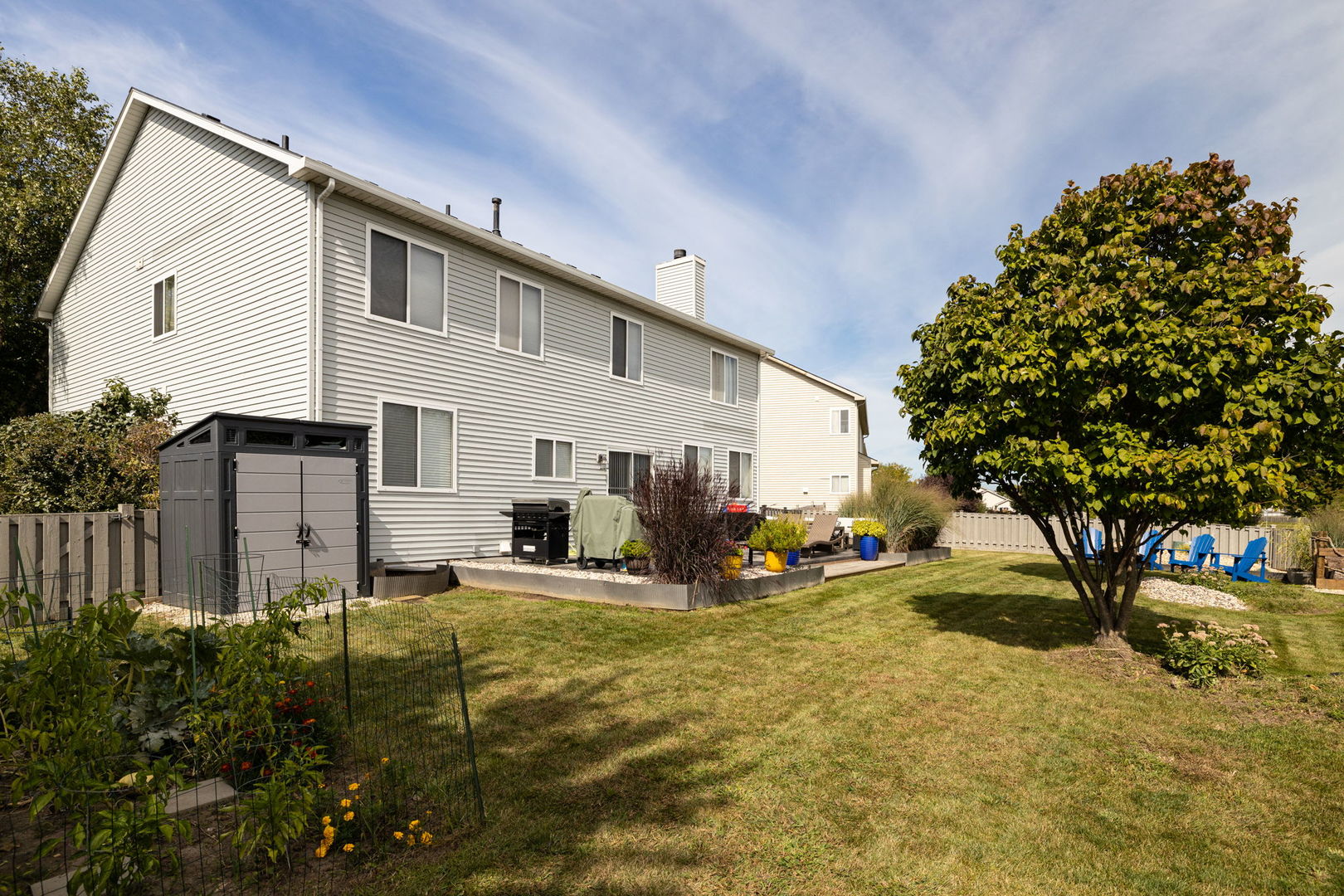 416 Hubbard Circle Plano, IL 60545 - Photo 44 of 57 a view of a house with backyard and sitting area