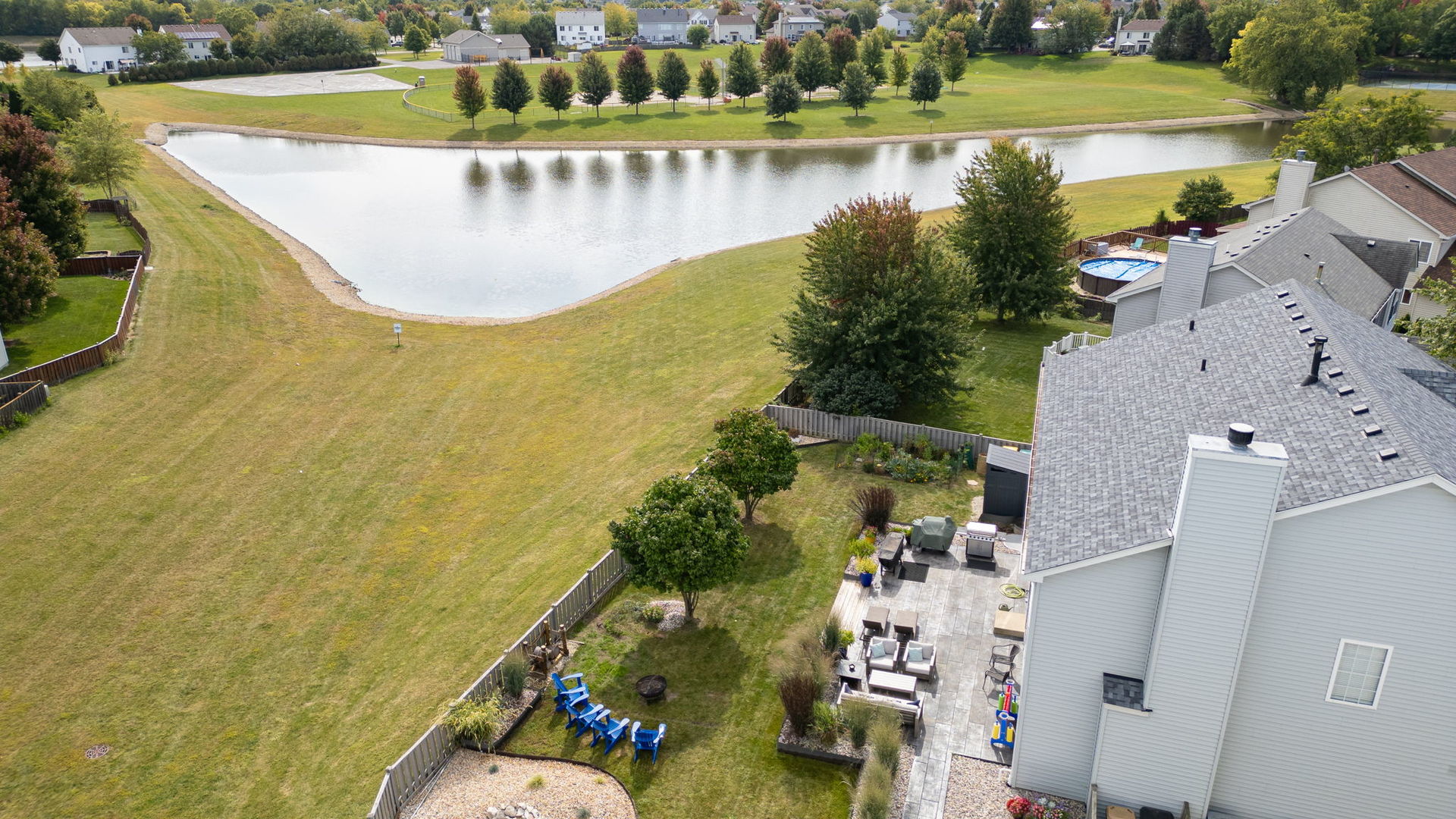 416 Hubbard Circle Plano, IL 60545 - Photo 47 of 57 a view of a swimming pool with a yard