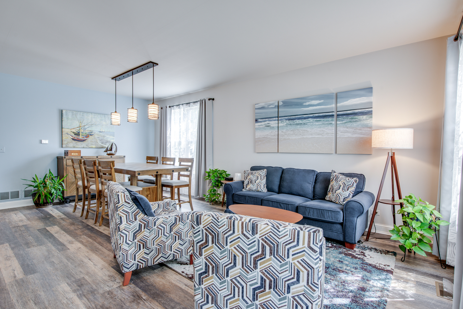 416 Hubbard Circle Plano, IL 60545 - Photo 5 of 57 a living room with furniture and a chandelier