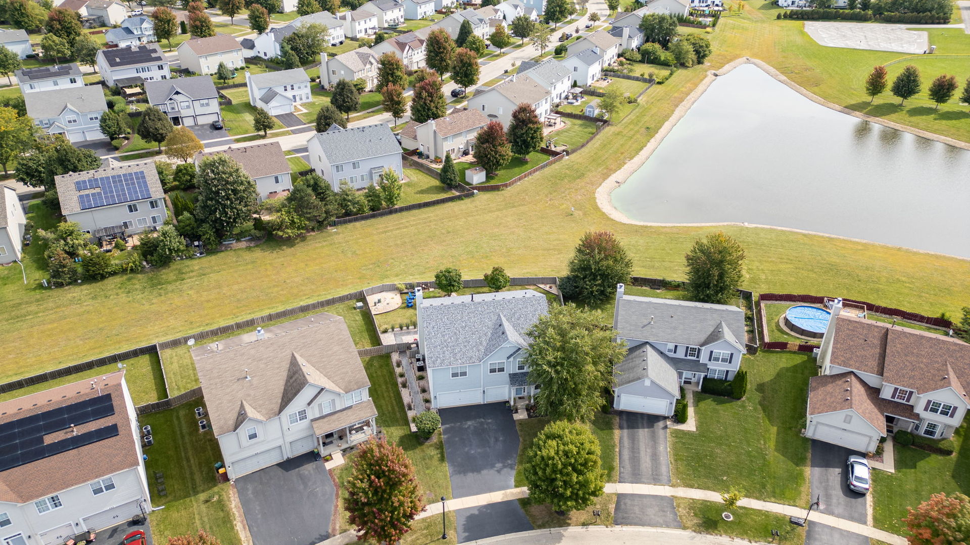 416 Hubbard Circle Plano, IL 60545 - Photo 54 of 57 an aerial view of residential houses with outdoor space and swimming pool