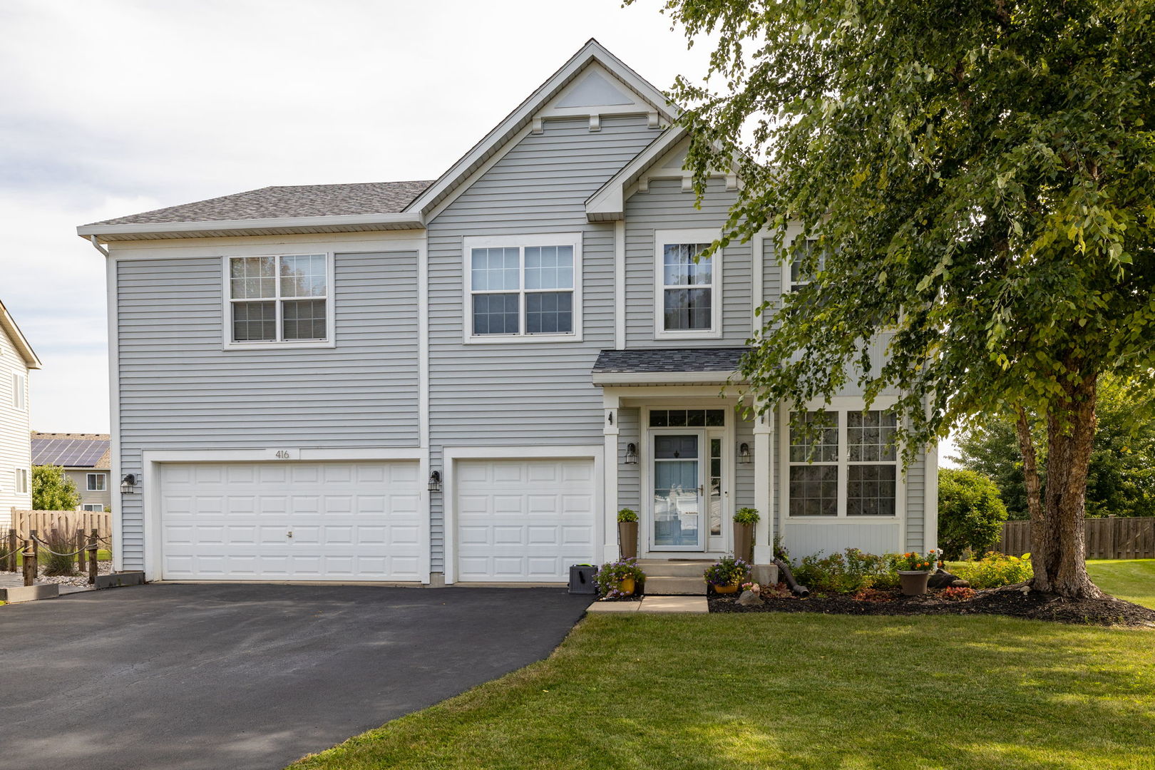 416 Hubbard Circle Plano, IL 60545 - Photo 57 of 57 front view of a house with a yard