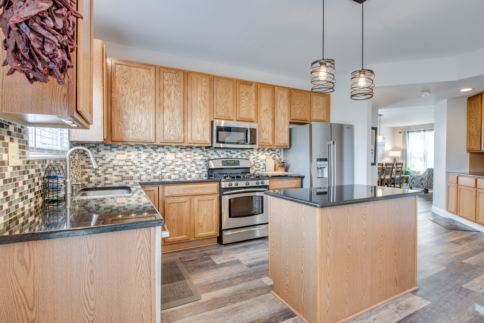 416 Hubbard Circle Plano, IL 60545 - Photo 9 of 57 a kitchen with stainless steel appliances granite countertop a refrigerator a stove a sink and a granite counter tops