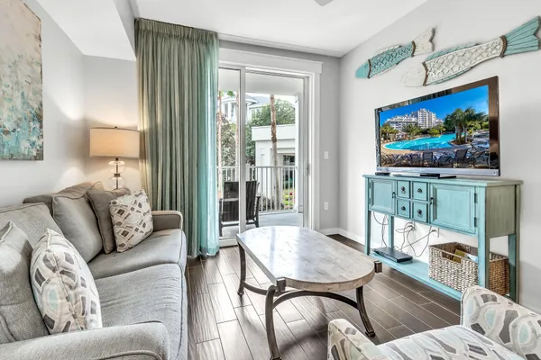 a living room with furniture and a flat screen tv