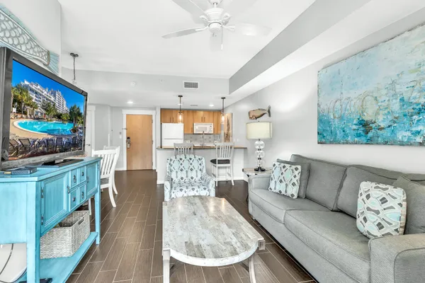a living room with furniture and a flat screen tv
