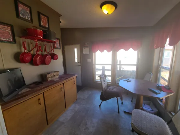 a view of a livingroom with furniture and window