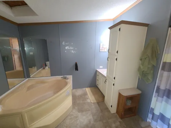 a bathroom with a tub and sink