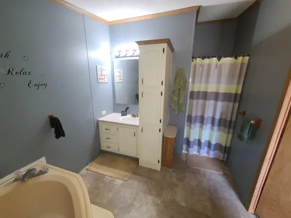 a bathroom with a sink and mirror
