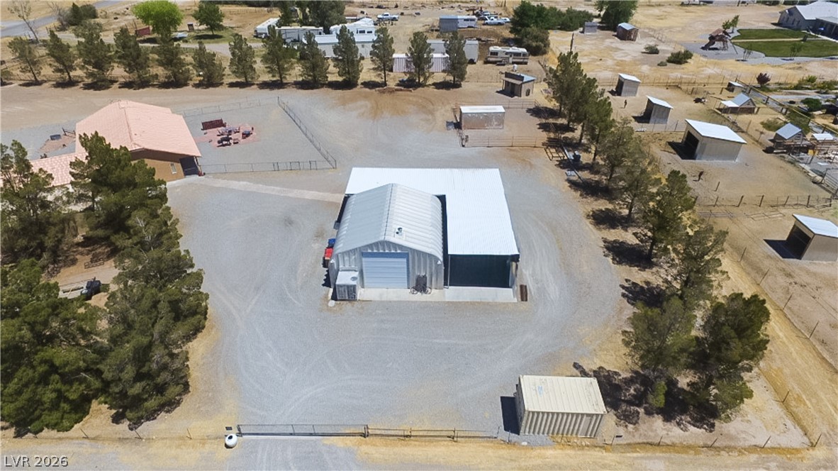 2381 Tough Boy Road Pahrump, NV 89060 - Photo 40 of 44 This expansive property offers a substantial workshop and ample outdoor space, perfect for various ventures.