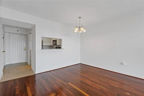 a view of a livingroom with wooden floor