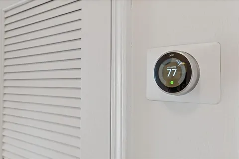 a close up view of a utility room with a washer and dryer