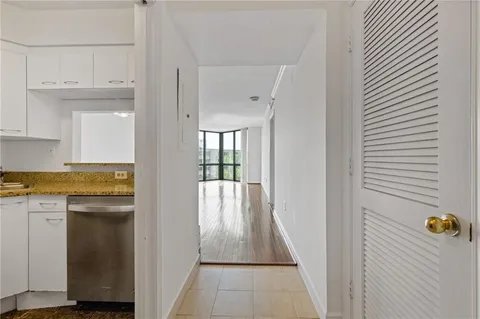 a view of a kitchen from the hallway