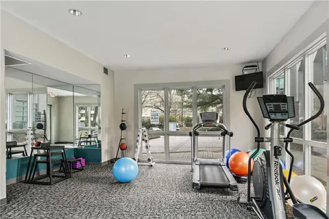 a room with furniture and gym equipment