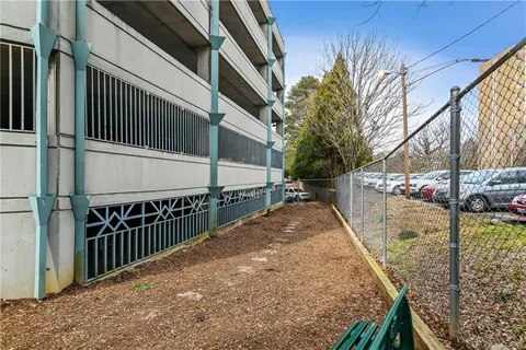 a view of a balcony with wooden fence