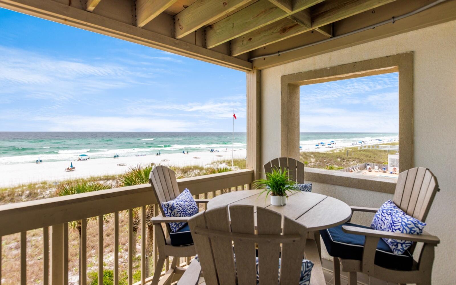 a view of a balcony with chair and wooden floor