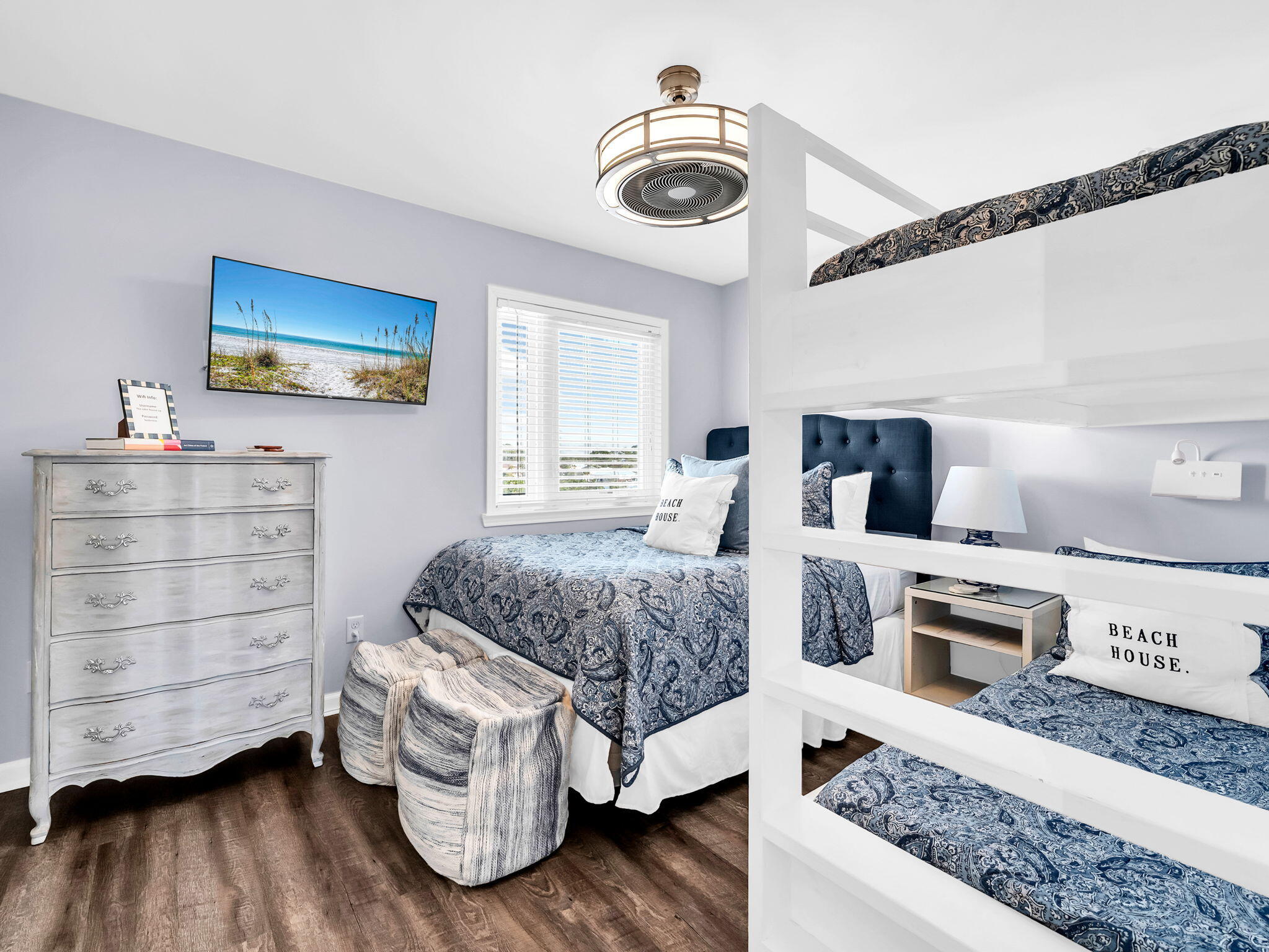 23011 Front Beach Road, Unit W42 Panama City Beach, FL 32413 - Photo 15 of 30 a bedroom with a bed and a television