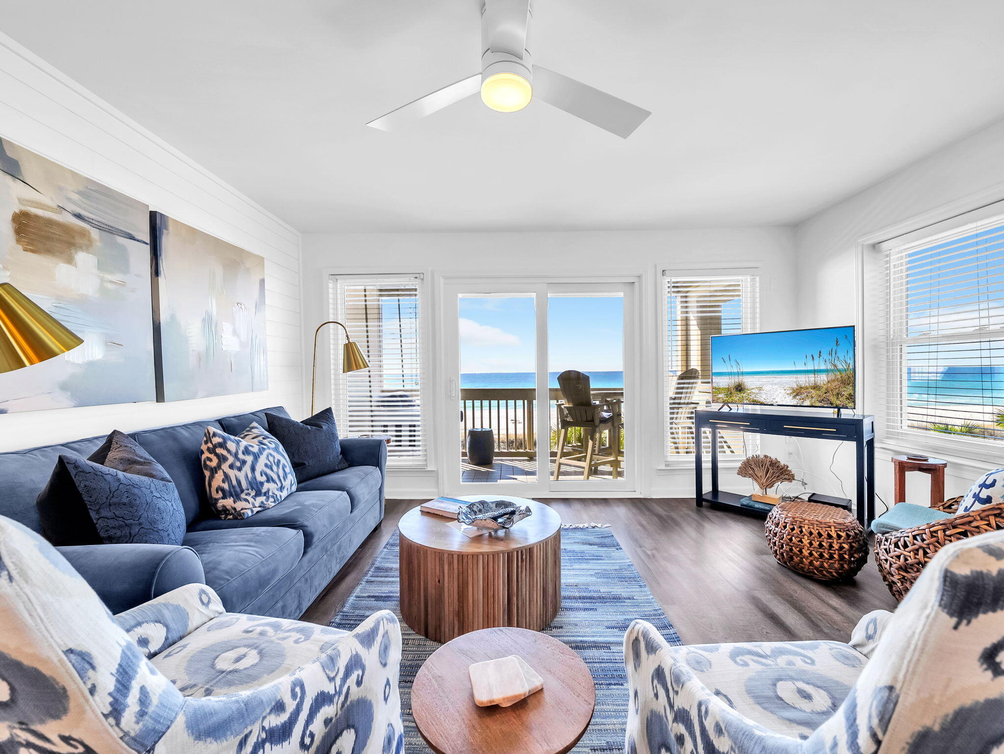 23011 Front Beach Road, Unit W42 Panama City Beach, FL 32413 - Photo 4 of 30 a living room with furniture and a lamp
