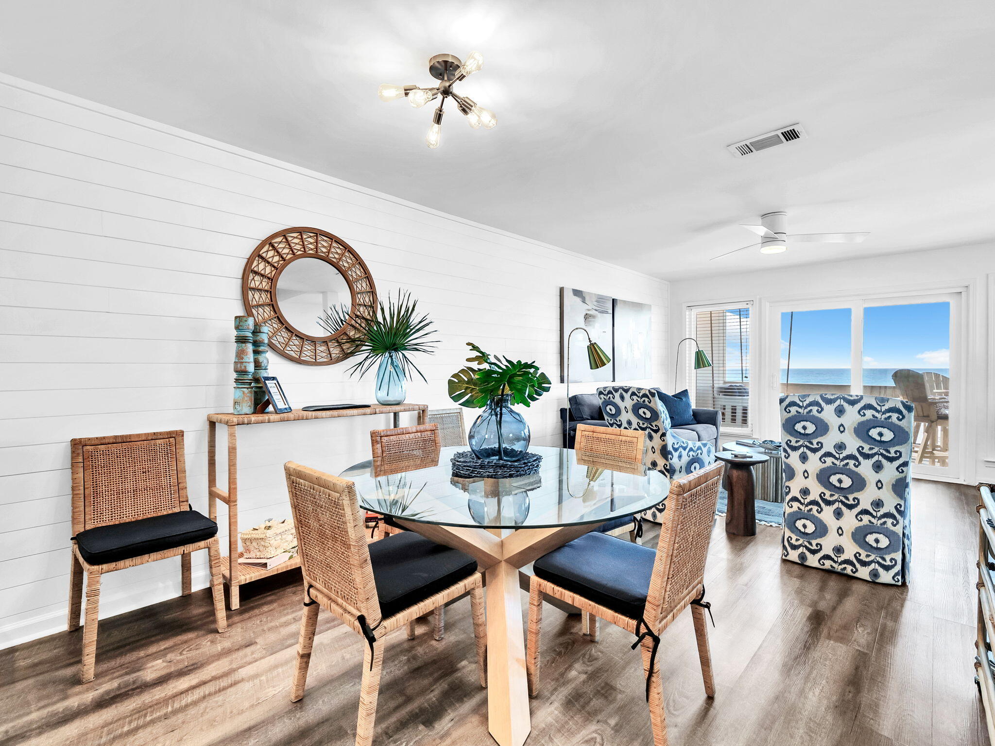 23011 Front Beach Road, Unit W42 Panama City Beach, FL 32413 - Photo 6 of 30 a view of a dining room with furniture and wooden floor