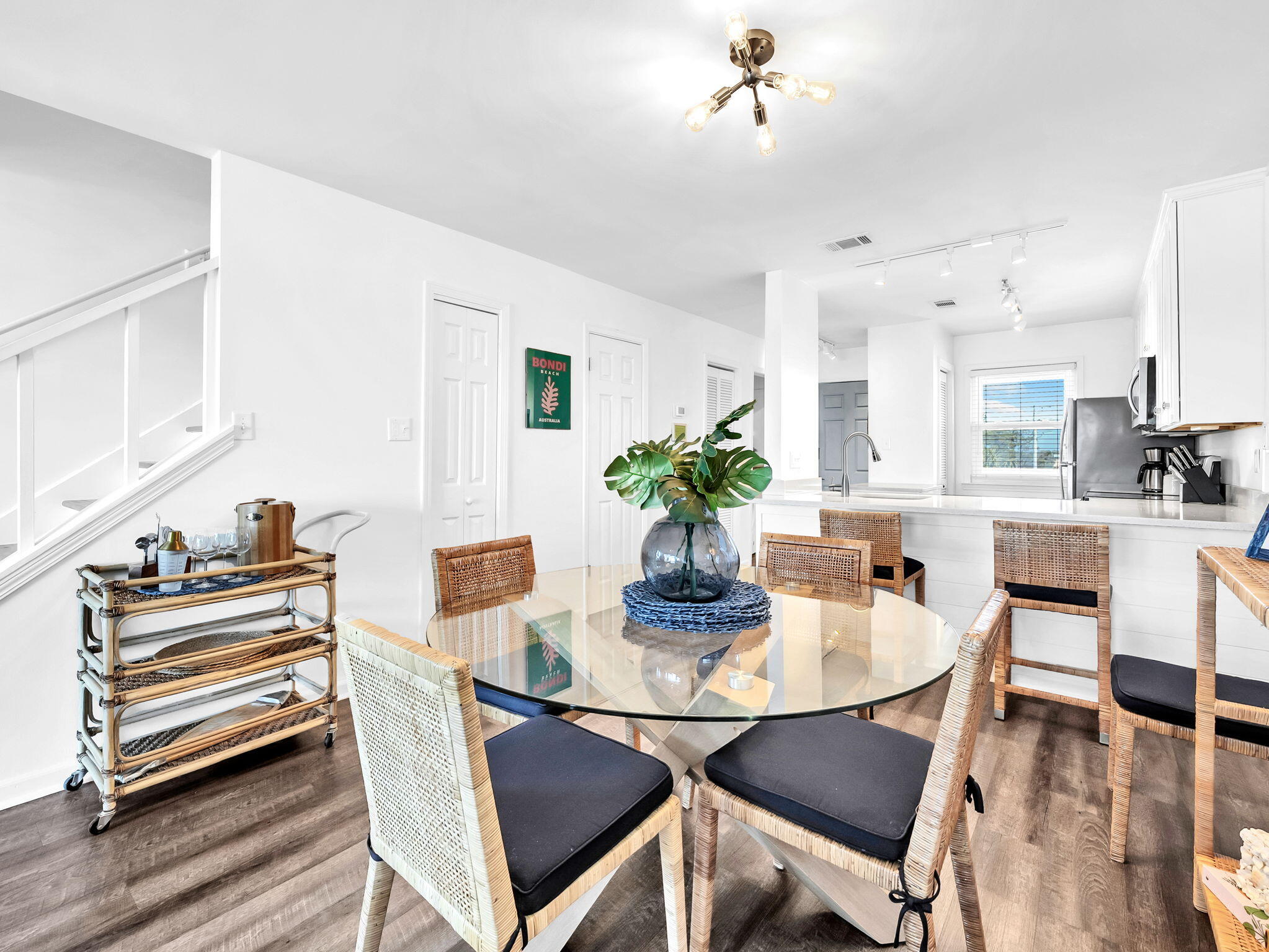 23011 Front Beach Road, Unit W42 Panama City Beach, FL 32413 - Photo 7 of 30 a dining room with furniture and wooden floor