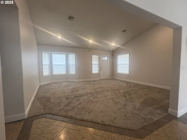 a view of an empty room and window