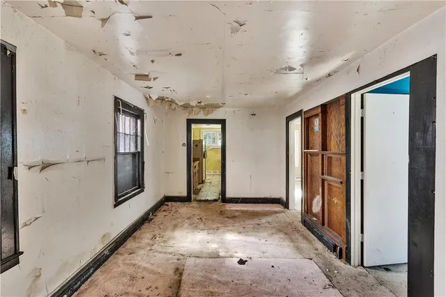 a view of a hallway with a bathroom