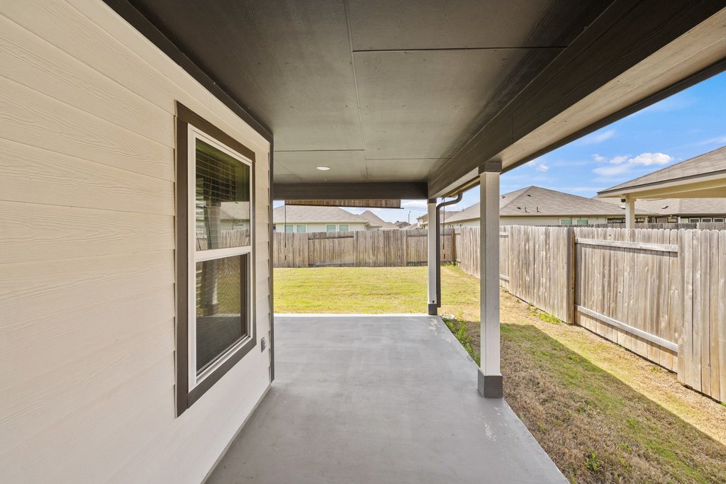 105 Cupa Monti Road Hutto, TX 78634 - Photo 23 of 28 Fenced backyard featuring a patio area