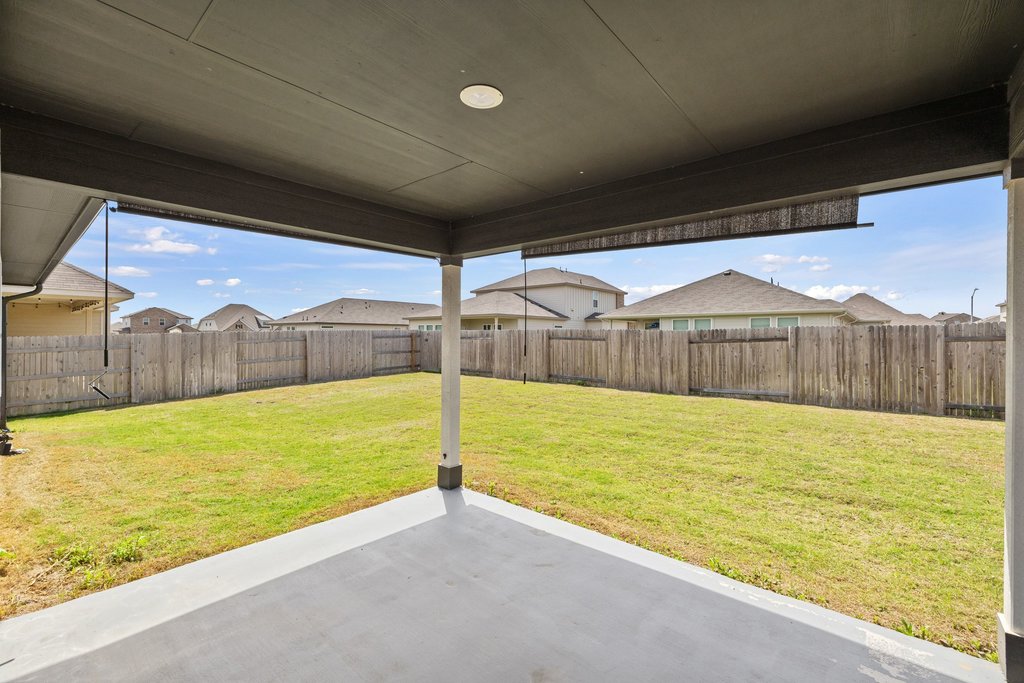 105 Cupa Monti Road Hutto, TX 78634 - Photo 24 of 28 Fenced backyard with a residential view and a patio area