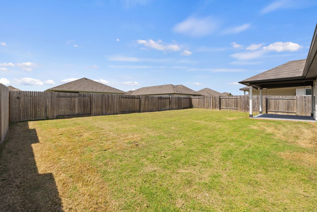 105 Cupa Monti Road Hutto, TX 78634 - Photo 28 of 28 Fenced backyard with a patio area