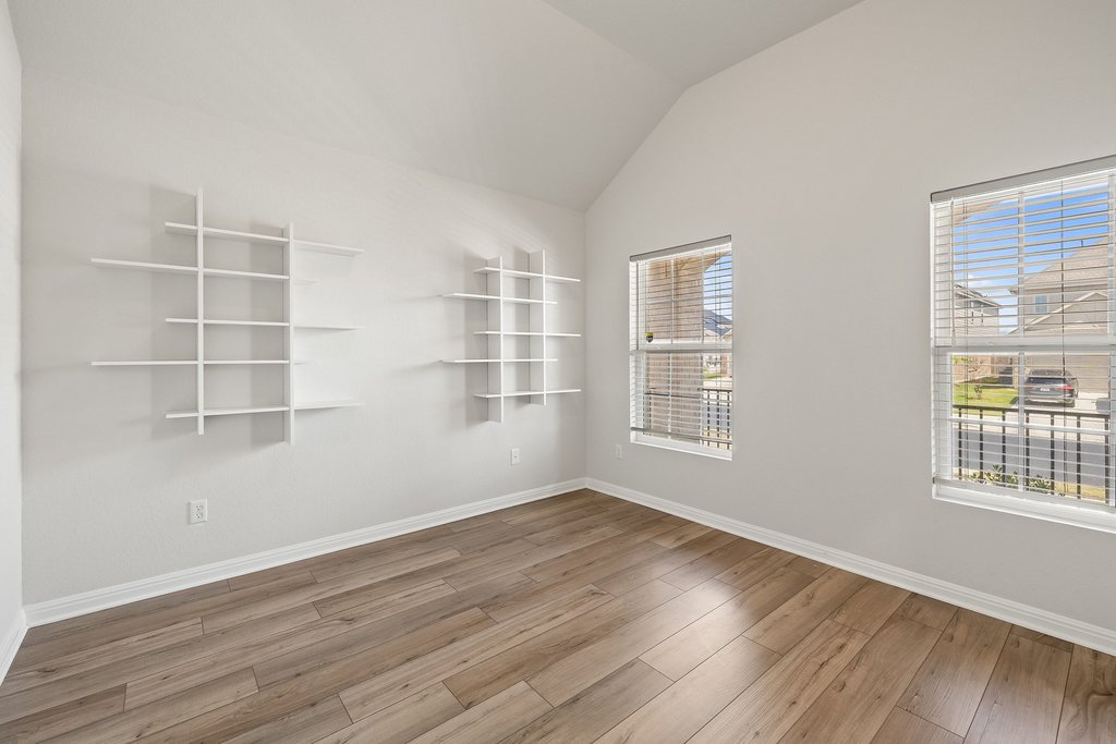 105 Cupa Monti Road Hutto, TX 78634 - Photo 4 of 28 Office/flex space with lofted ceiling and light wood finished floors
