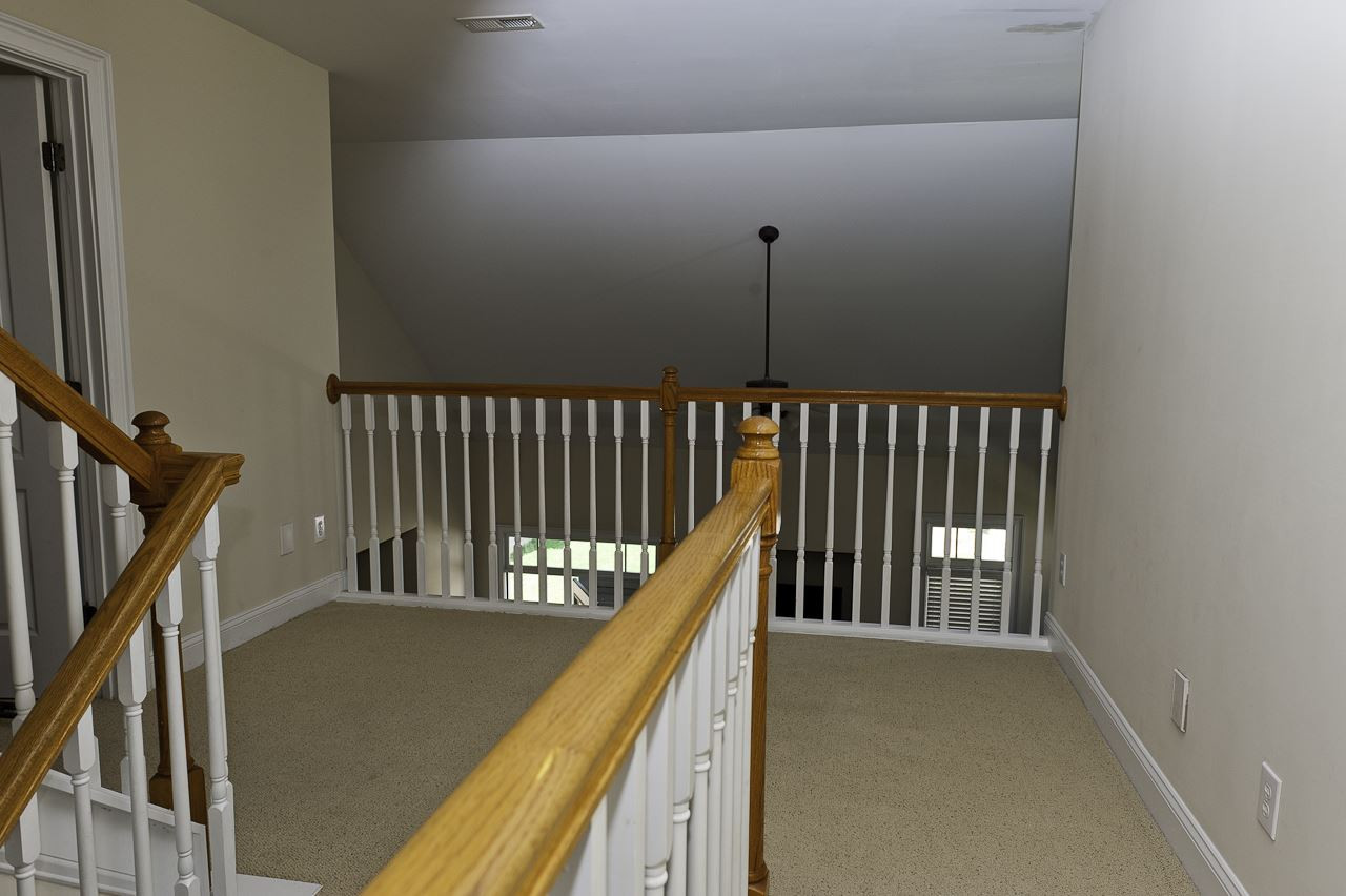 113 Fort Jackson Road Morrisville, NC 27560 - Photo 20 of 25 2ND FLOOR LANDING OVERLOOKING FAMILY ROOM