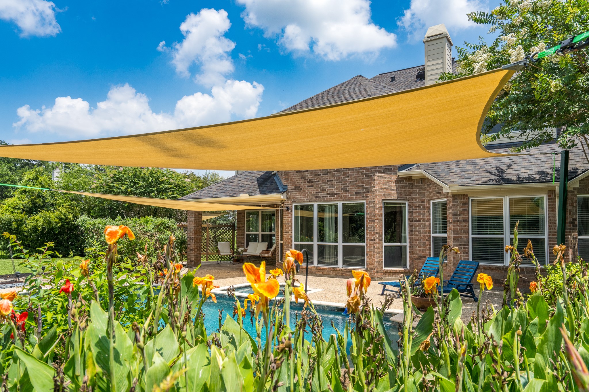 5914 Oakmoss Trail Spring, TX 77379 - Photo 36 of 50 This stunning backyard features resort style landscaping making it feel like your spending time at a 5 star luxury escape!