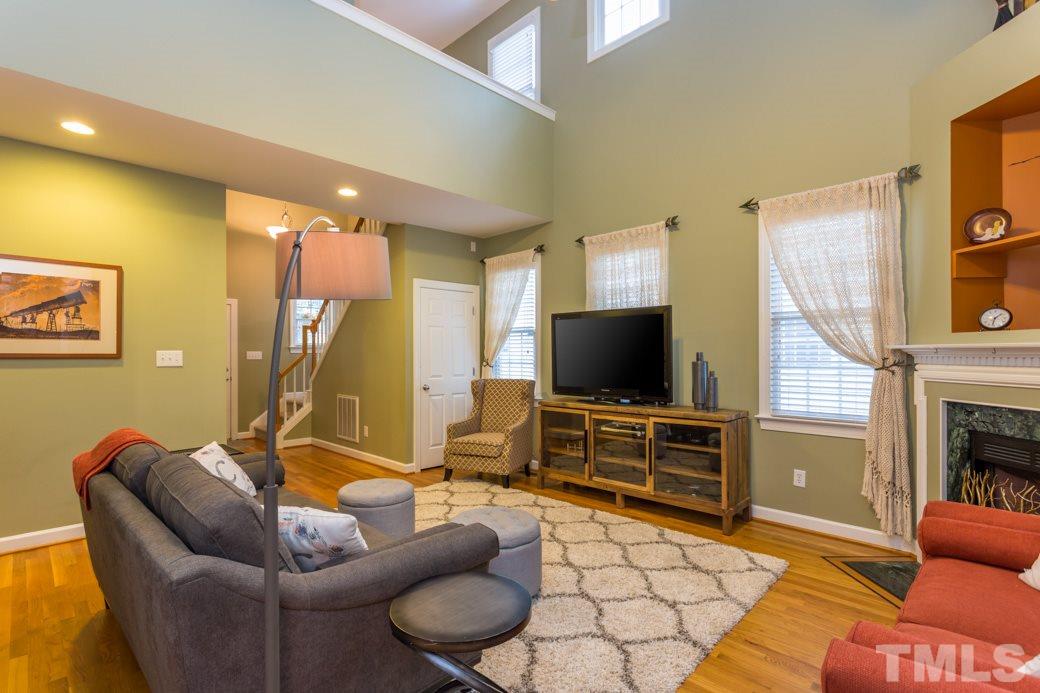 816 Nowell Ridge Road Raleigh, NC 27607 - Photo 2 of 9 a living room with furniture and a flat screen tv