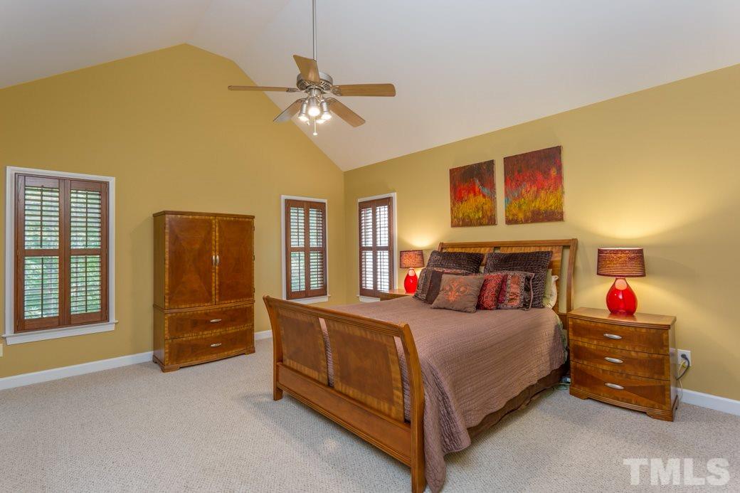 816 Nowell Ridge Road Raleigh, NC 27607 - Photo 6 of 9 a bedroom with a bed and dresser