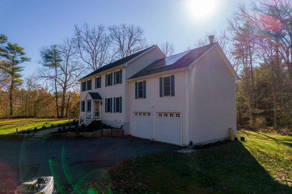 989 Walnut Plain Road Rochester, MA 02770 - Photo 12 of 41 a view of a house with backyard and trees