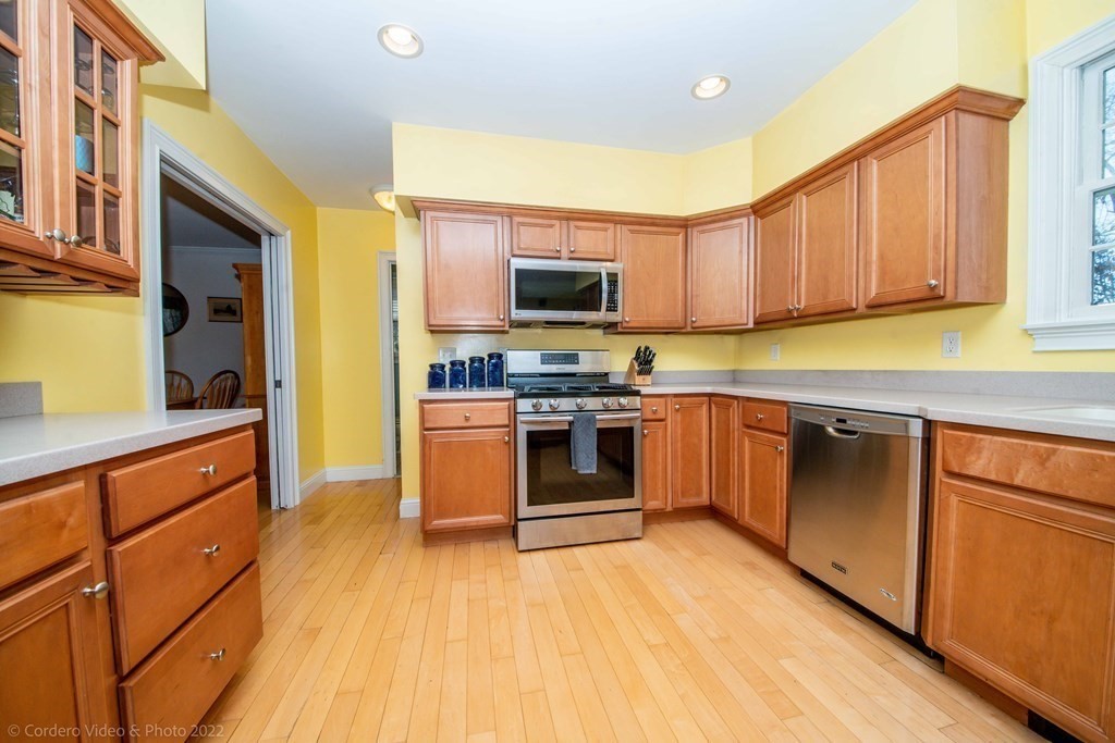 989 Walnut Plain Road Rochester, MA 02770 - Photo 15 of 41 a kitchen with stainless steel appliances granite countertop a stove a sink and a microwave