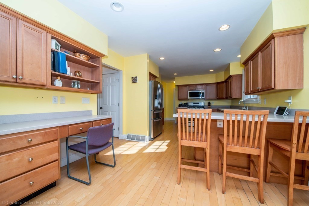 989 Walnut Plain Road Rochester, MA 02770 - Photo 16 of 41 a kitchen with a table chairs and cabinets