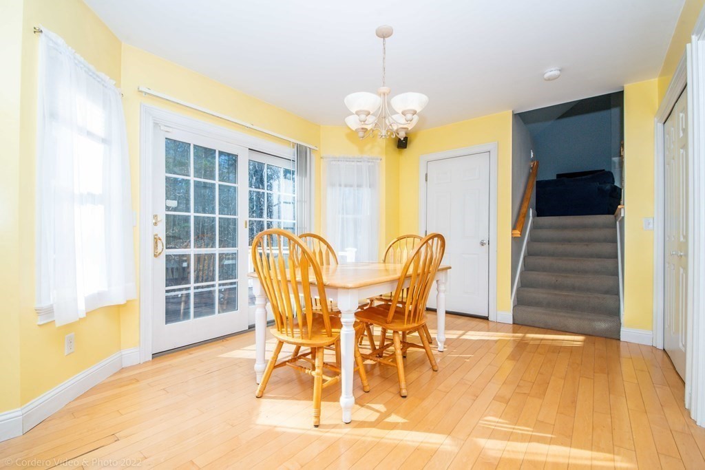 989 Walnut Plain Road Rochester, MA 02770 - Photo 22 of 41 a view of a dining room with furniture and wooden floor