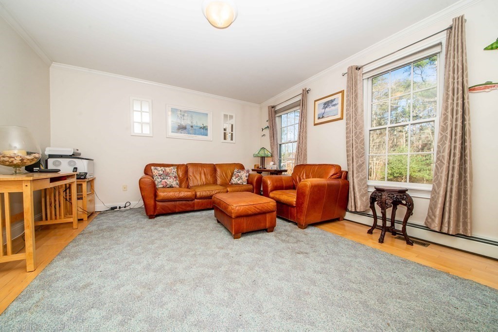 989 Walnut Plain Road Rochester, MA 02770 - Photo 25 of 41 a living room with furniture and a window