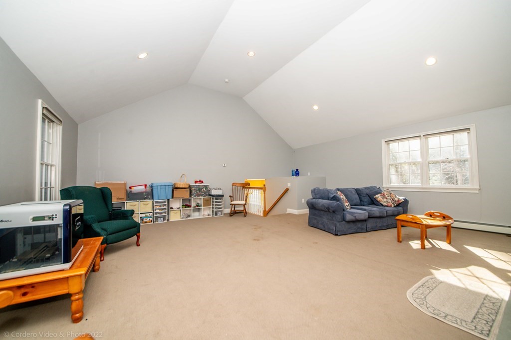 989 Walnut Plain Road Rochester, MA 02770 - Photo 29 of 41 a living room with furniture a air conditioner vent and a window