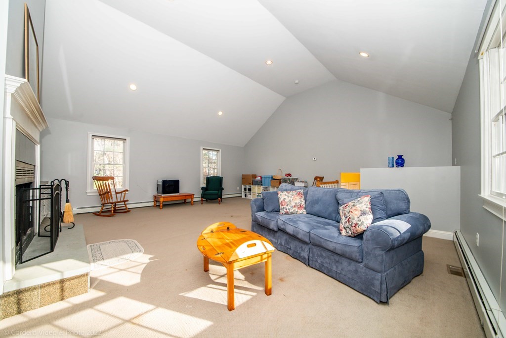 989 Walnut Plain Road Rochester, MA 02770 - Photo 30 of 41 a living room with furniture and a wooden floor