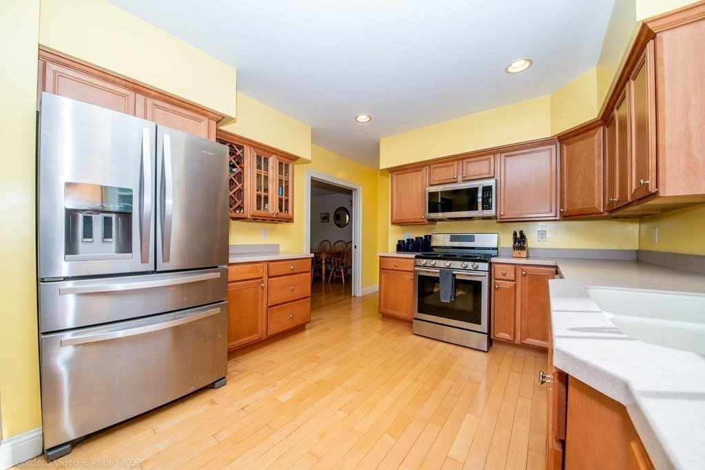 989 Walnut Plain Road Rochester, MA 02770 - Photo 3 of 41 a kitchen with stainless steel appliances and refrigerator