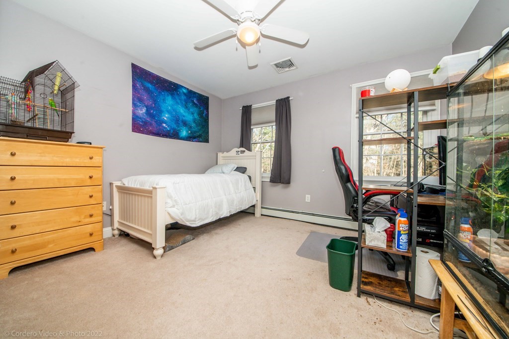 989 Walnut Plain Road Rochester, MA 02770 - Photo 34 of 41 a bedroom with a bed and a window