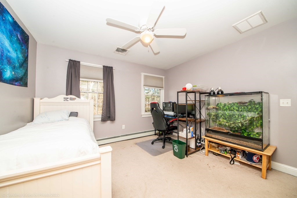 989 Walnut Plain Road Rochester, MA 02770 - Photo 35 of 41 a room with a bed and a large window