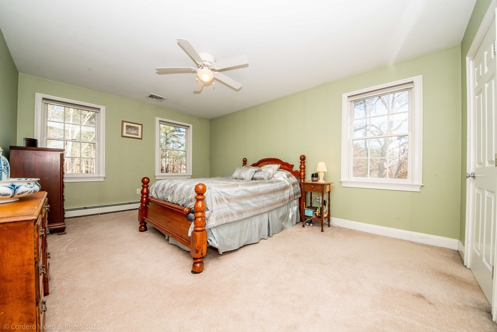 989 Walnut Plain Road Rochester, MA 02770 - Photo 39 of 41 a bedroom with a bed and a window