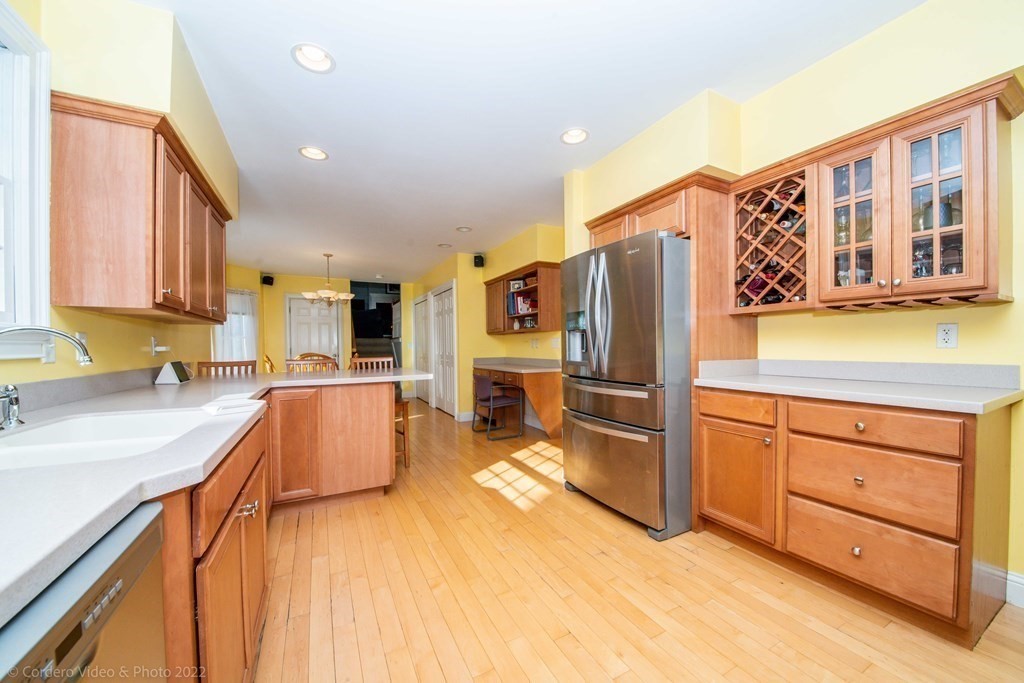 989 Walnut Plain Road Rochester, MA 02770 - Photo 4 of 41 a kitchen with stainless steel appliances granite countertop a refrigerator and a sink
