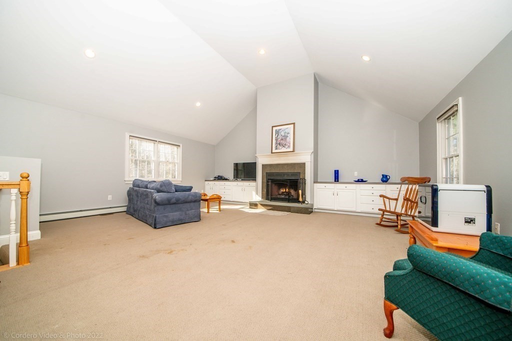 989 Walnut Plain Road Rochester, MA 02770 - Photo 5 of 41 a living room with furniture and a fireplace