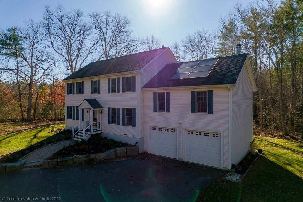 989 Walnut Plain Road Rochester, MA 02770 - Photo 7 of 41 a view of a house with a yard