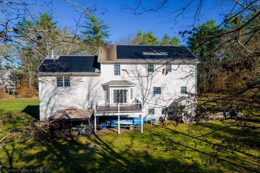 989 Walnut Plain Road Rochester, MA 02770 - Photo 9 of 41 a front view of house with a yard
