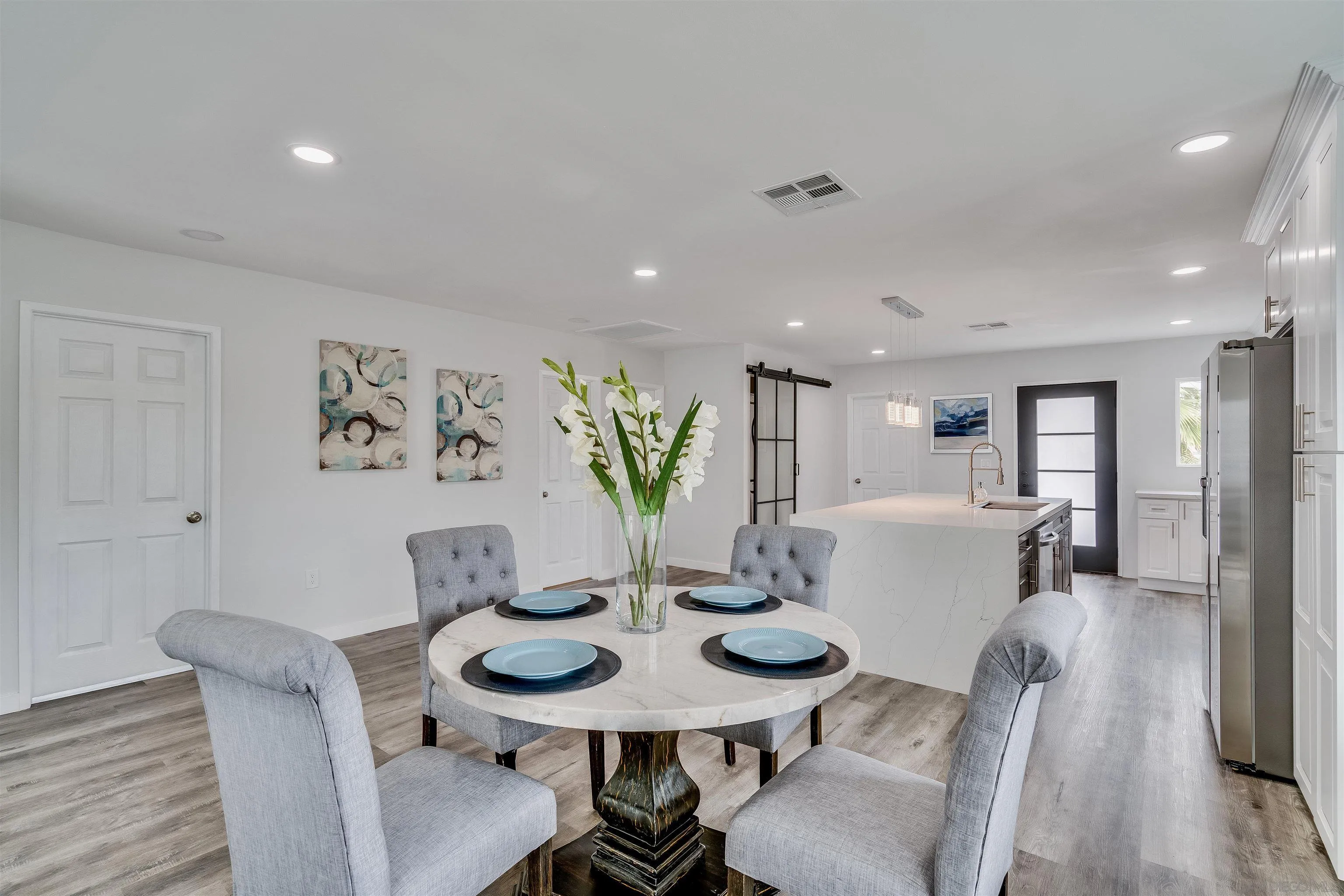 9209 Jamacha Boulevard Spring Valley, CA 91977 - Photo 12 of 22 a view of a dining room with furniture and wooden floor